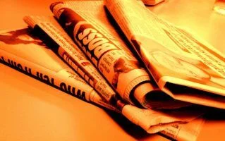 newspaper fire orange by Jon via Flikr