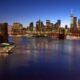 Brooklyn Bridge, Downtown Manhattan, and One World Trade Center, blue hour by John Cunniff via Flickr