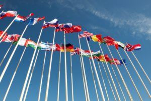 flags on flagpoles fluttering in the wind