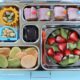 Kindergarten school lunch - ham & cheese rolls, nuts, veggie chips, strawberries and kiwi, organic dark chocolate by Melissa via Flickr