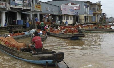 Merchants on the Mekong River by -JvL - via flickr